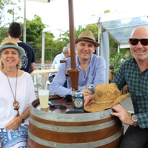 People enjoying a drink at the cider bar