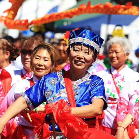 Woman in traditional costume in parade