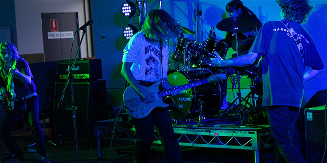 Young people playing a gig