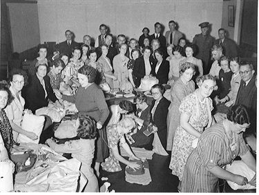 Volunteers packing soldiers’ comfort parcels at Ryde Town Hall December 1940.  Ryde’s local patriotic fund during WWII consisted of six sub-committees which collected money and made parcels and comforts for the troops. Beginning with 288 parcels in 1940 it reached a peak of 3645 parcels in 1944. Ryde Library Service. Acc. 548118A. Ryde Patriotic Fund / 1