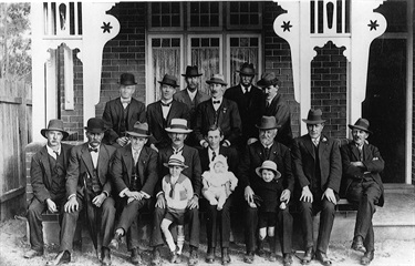Members of the Gladesville branch of the Voluntary Workers Association.  The VWA members are outside Karoola, 46 Frederick Street, Ryde, the home they built for William & Lanetta Jackson. William was severely injured in WWI; in this photo he holds his baby daughter. Ryde Library Service. Acc. 5579589. Voluntary Workers Association / 3