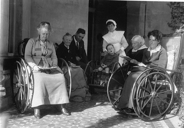 Group of patients seated on the terrace at Weemala, c.1923.  Weemala was opened in April 1907. It was the new site for The Home for Incurables, originally established in Redfern in 1900. Ryde Library Service. Acc. 5579791. Weemala, Ryde / 22