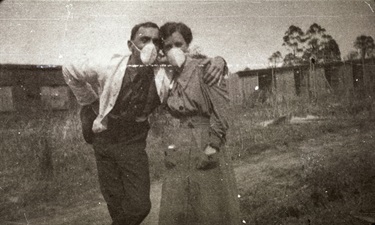 People wearing masks in Herring Road, North Ryde, 1919.  Look familiar? During the 1919 Influenza Pandemic, citizens were encouraged to wear masks, just as we are now.  Ryde District Historical Society. Image 10186; negative 360/01.