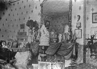 Interior decoration of Eastwood House. Built in 1842 by William Rutledge on 90 acres originally granted to John Love, Eastwood House became the home of Ryde’s first mayor Edward Terry, his wife Isabel and their children. This photograph shows a typical Victorian- era room, filled with photos, ornaments and furniture. Ryde Library Service. Acc. 496988A. Eastwood House / 4.