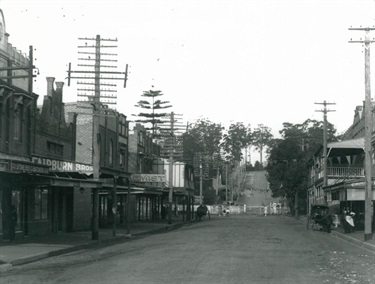 Blaxland Road, Eastwood, now Rowe Street around 1912. Looking east along Blaxland Road (now Rowe Street) towards the level crossing and the railway line. Ryde Library Service. Acc. 5158478. Rowe Street, Eastwood / 5.