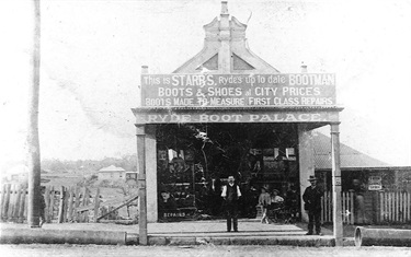 Charles Starr’s shoe store, Ryde Boot Palace, around 1909. In the first decade of the 20th century, Parkes St (now Blaxland Road) emerged as the main commercial street at Ryde. In 1901 a bootmaker opened in that street, almost opposite the end of Church Street. Charles Starr took over this business in 1905 and he can be seen here standing in front of his shop with an almost empty paddock stretching behind him to Pope Street. Ryde Library Service. Acc. 4738217. Parkes Street, Ryde / 4.