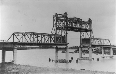 Opening of Ryde Bridge, 7 December 1935. The original bridge was opened on 7 December 1935 which resulted in the punt that operated from Bowden Street, Meadowbank to Blaxland Road, Rhodes ceasing operation. The bridge was financed with a grant of £53,000 from unemployment relief and a loan of £80,000. Tolls were introduced to repay the loan. Ryde Library Service. Acc. 5089344. Ryde Bridge / 1.