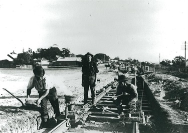 Laying of the Gladesville-Ryde tramway around 1909. The first ‘turning of the sod’ in the extension of the tramway from Drummoyne to Ryde took place in 1908. The line was completed in 1910. This is a scene mid-way in that process and exemplifies the hard physical nature of its construction. Ryde Library Service. Acc. 8504342. Tram & Tramways – Ryde / 2.