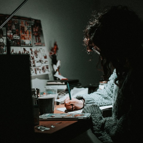 Photo of a person writing