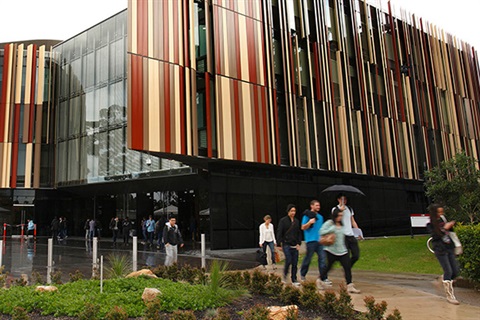 People walking past eye catching building