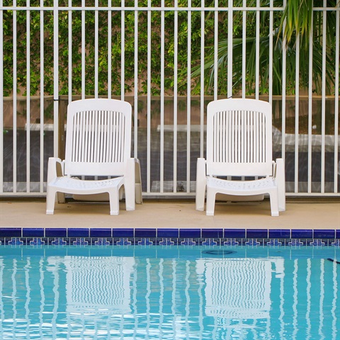 Pool with two chairs above