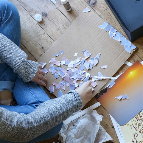 Photo of a person making a collage 
