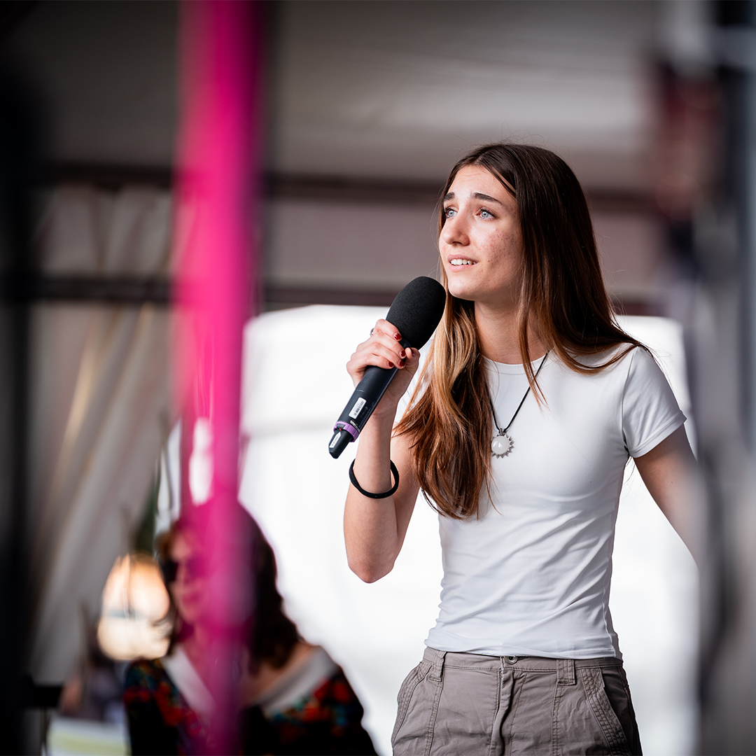 Girl singer with microphone in hand