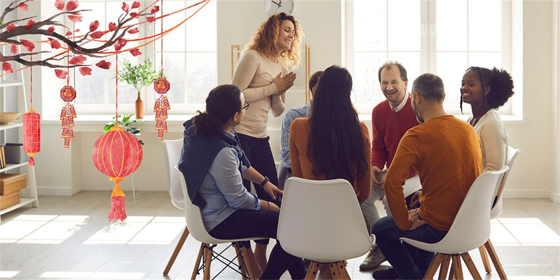 Group of people sitting in circle practicing speaking Mandarin