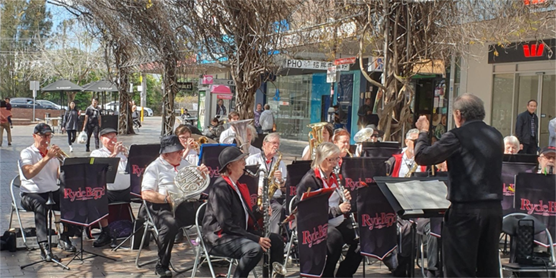 View of a concert band giving a performance outdoors