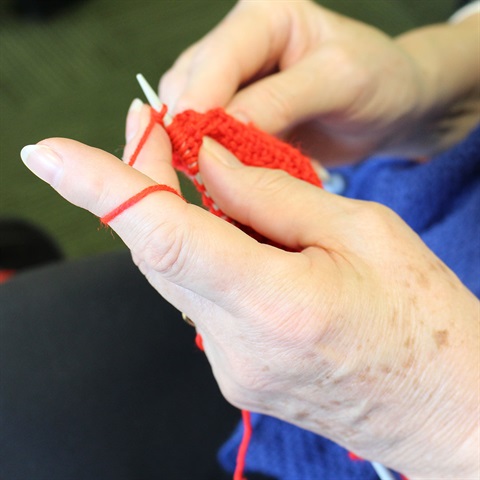 Close up of hands knitting