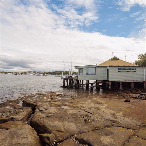 Small building structure built over the water