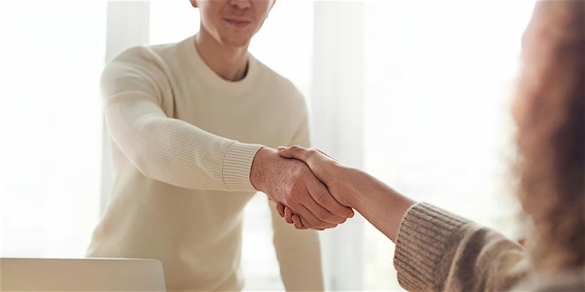 Two people shaking hands